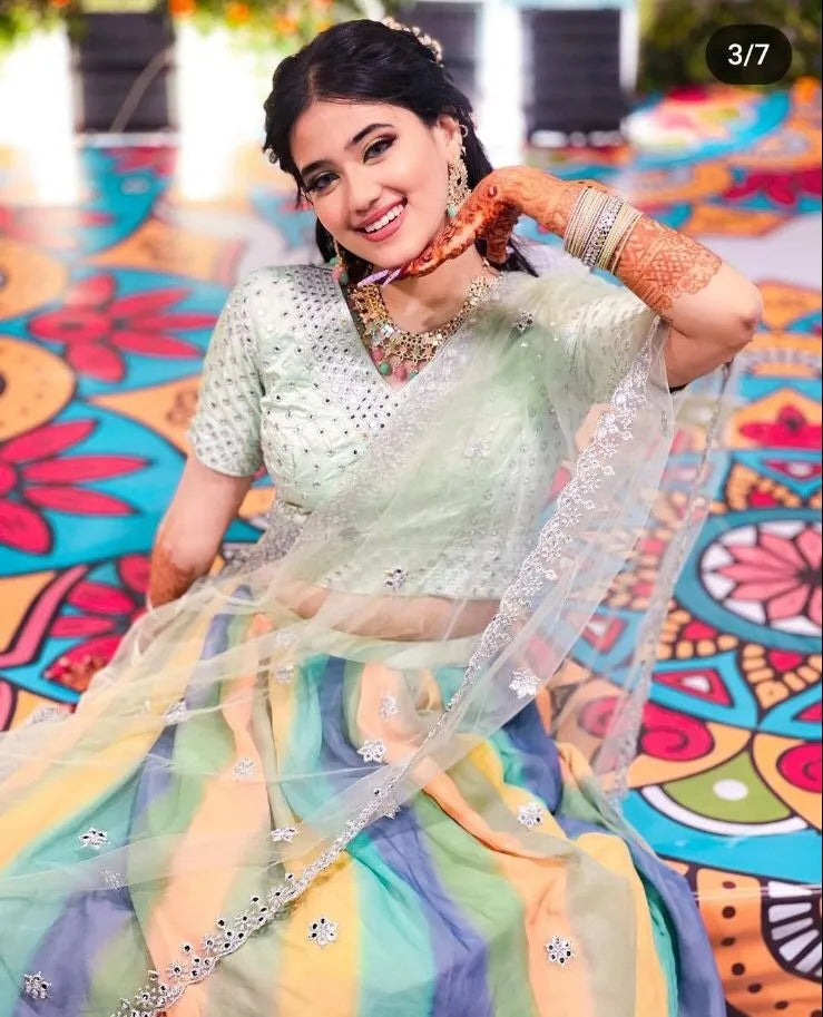 Woman in a light green saree with colorful patterns in the background - BlackBole High Quality indo western Dress