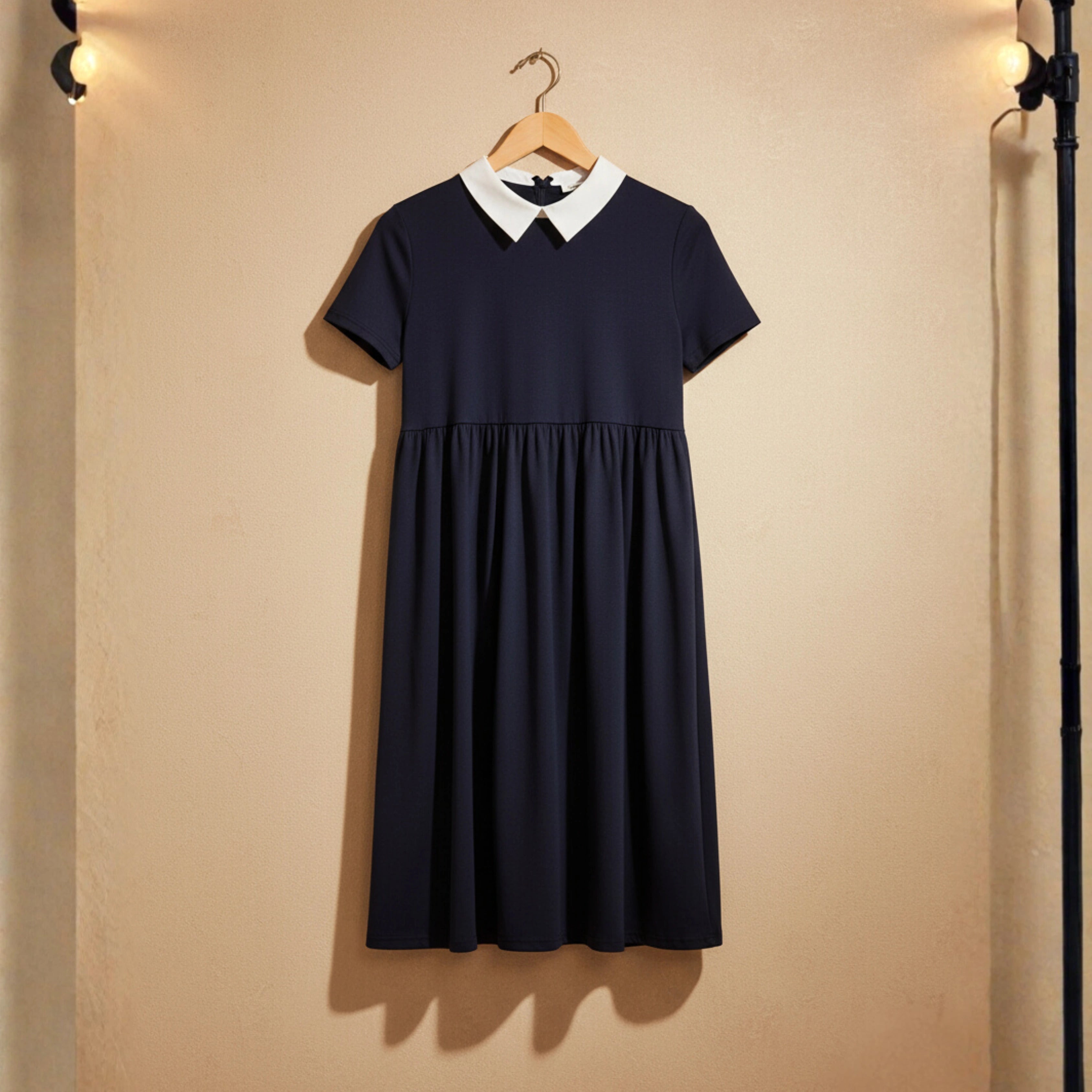 Navy dress with white collar on a wooden hanger against a beige wall - BlackBole High Quality Western Dress