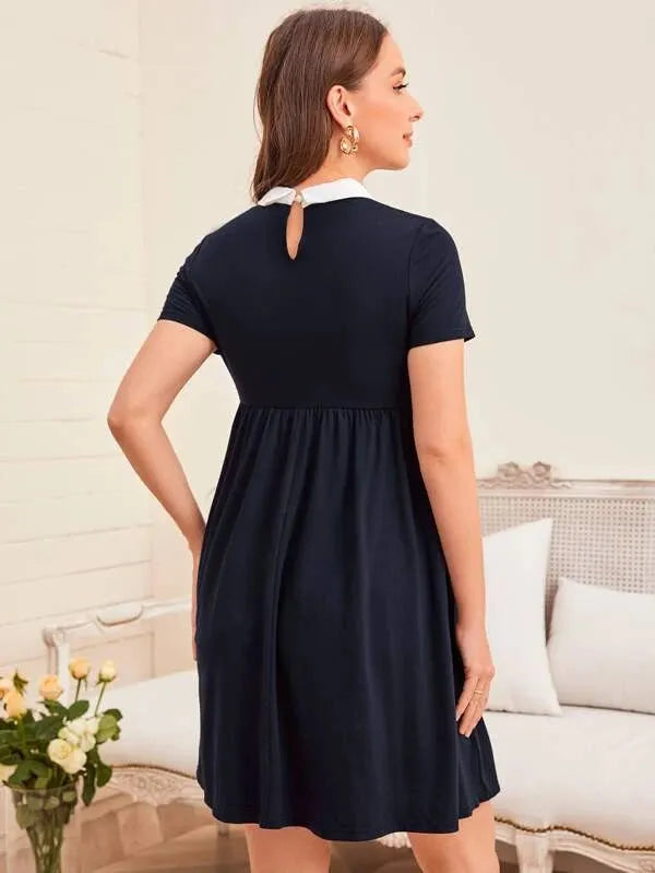 Woman wearing a navy blue dress in a living room setting - BlackBole High Quality Western Dress