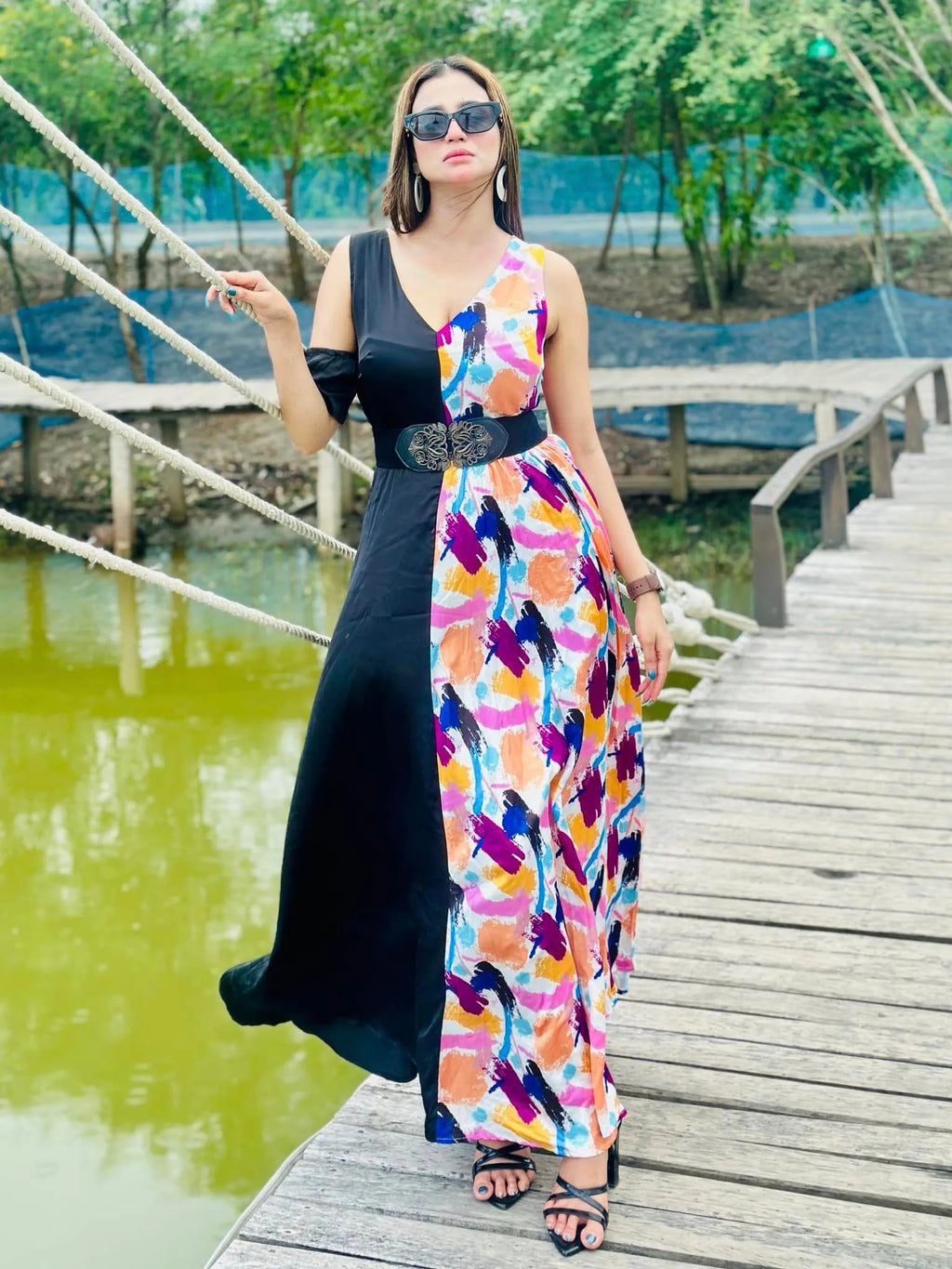 Woman in a colorful dress standing on a wooden bridge by a body of water - BlackBole High Quality Western Dress