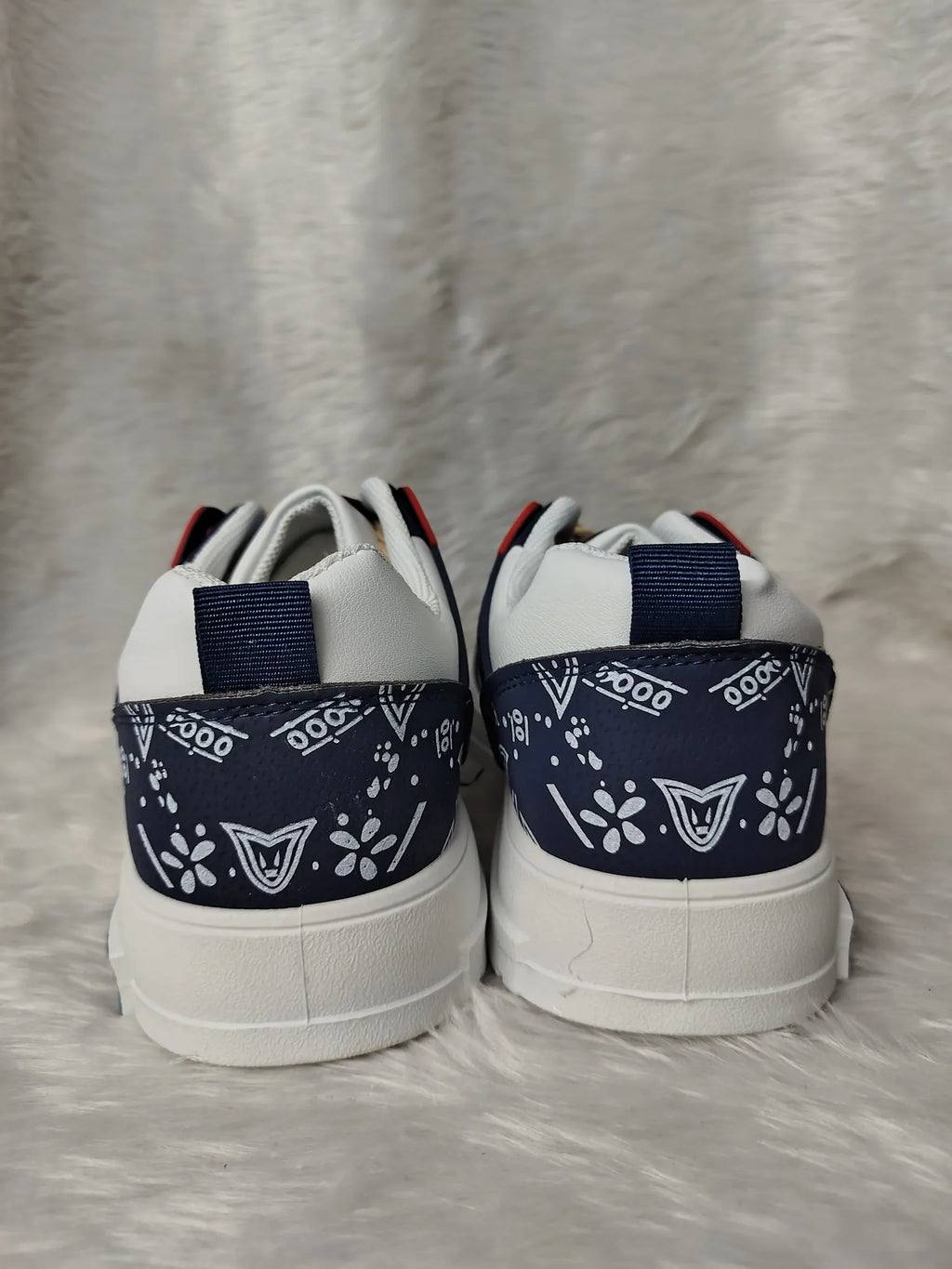 Pair of white sneakers with navy blue accents on a light gray background Men's Breathable casual Shoe
