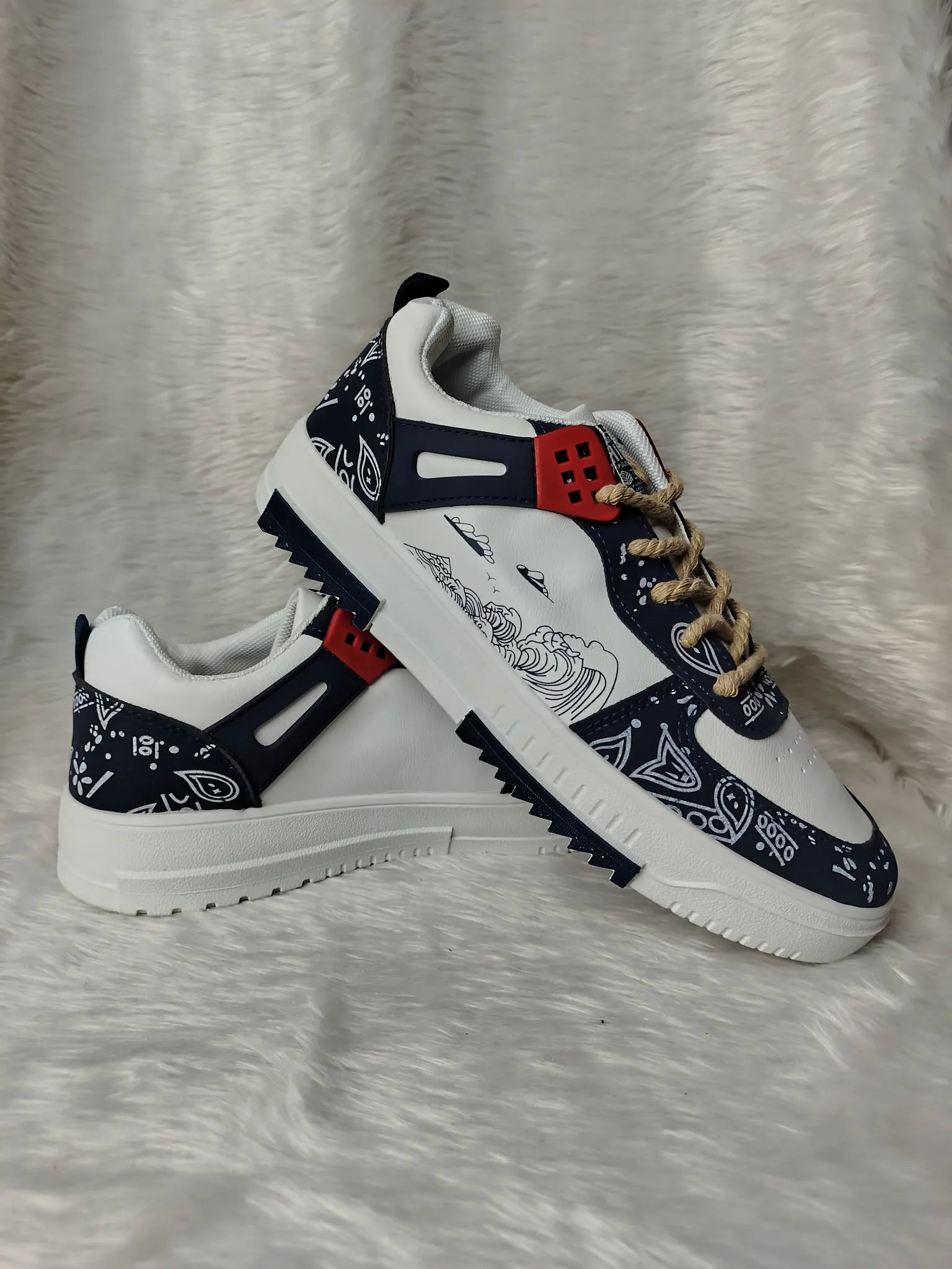 Pair of sneakers with bandana pattern on a textured white background - BlackBole High Quality Shoe