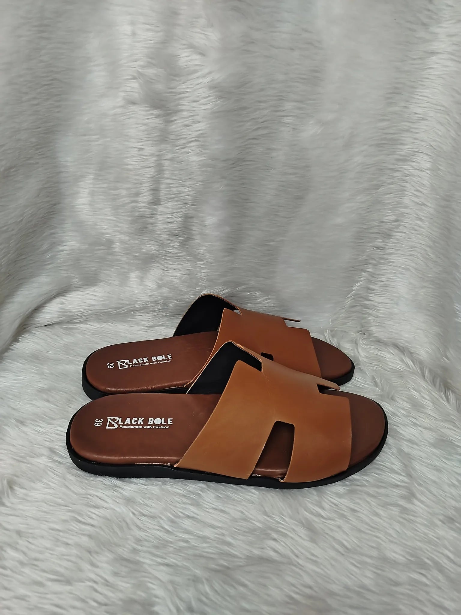 Brown sandals with black soles on a gray textured surface - BlackBole High Quality Sandal