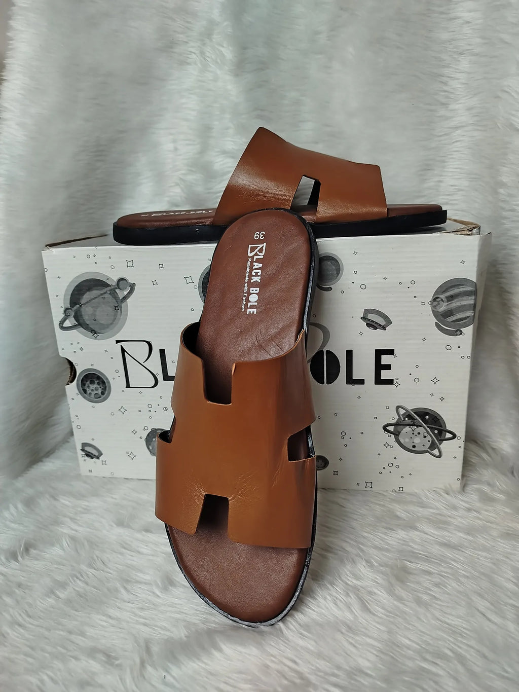 Brown sandals with a box featuring the brand 'Blickle' on a gray surface - BlackBole High Quality Sandal