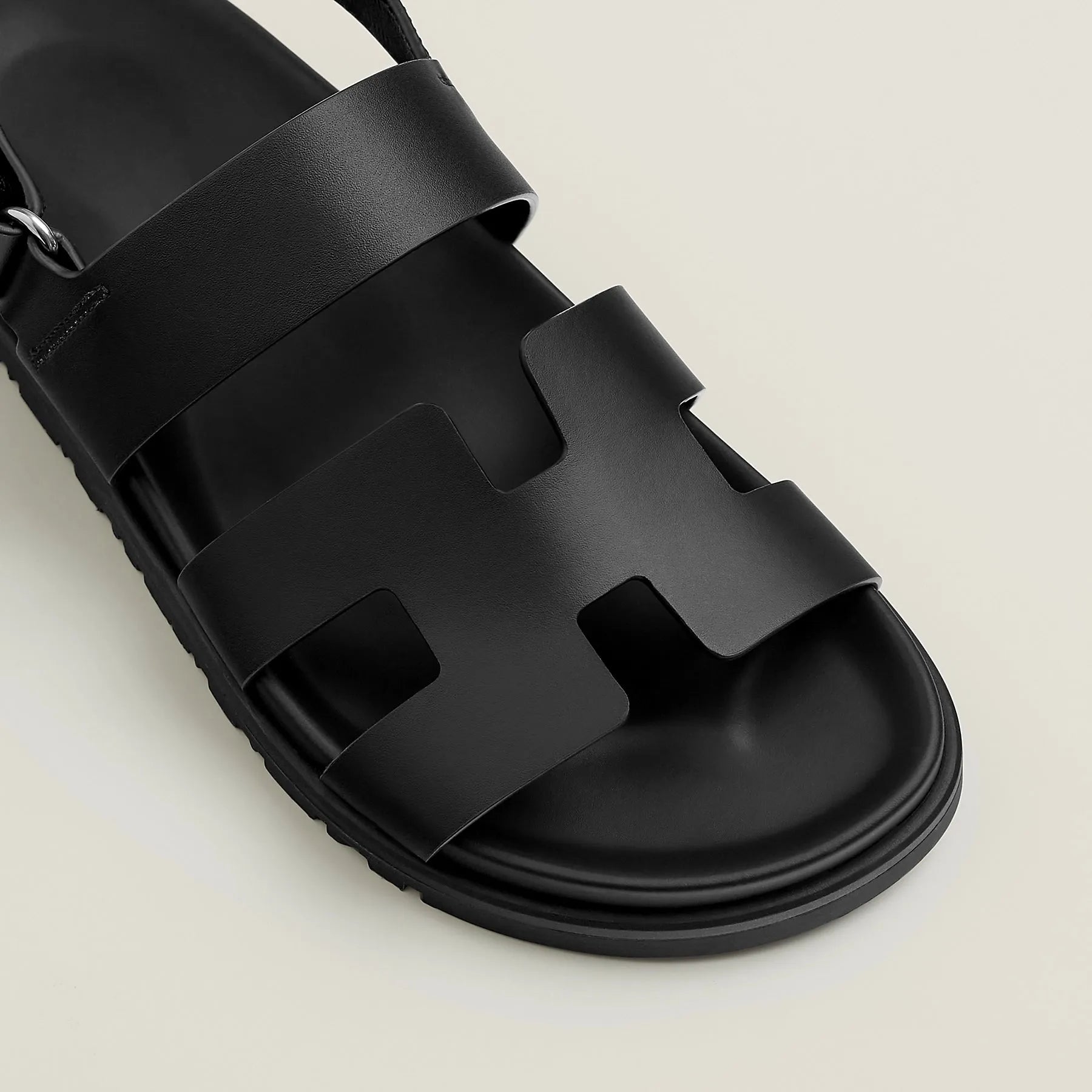 Black sandal with multiple straps on a light beige background - BlackBole High Quality Sandal
