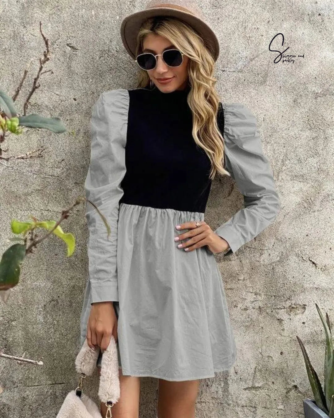 Woman wearing a black top and gray dress with sunglasses and a hat against a textured wall - BlackBole High Quality Western Dress