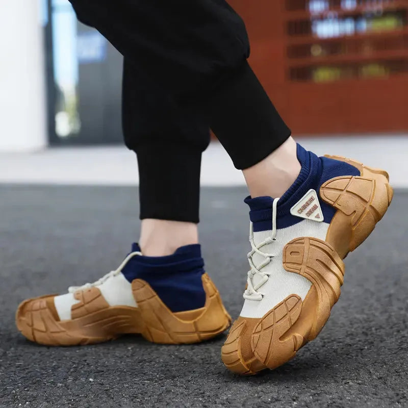 Brown and white sneakers with blue socks worn on a blurred background - BlackBole High Quality Shoe