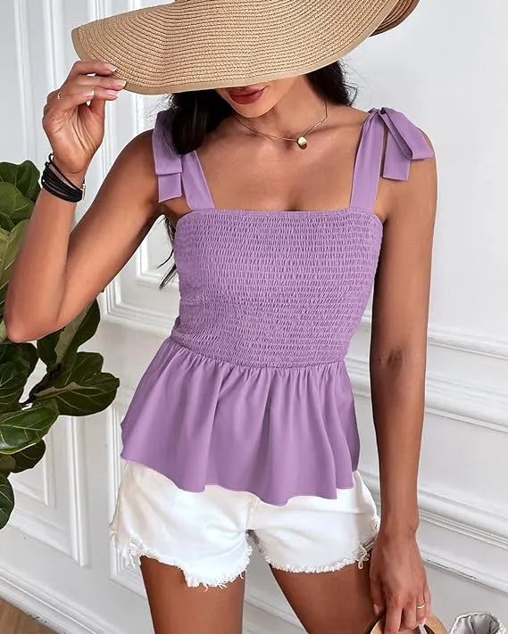 Woman wearing a purple top and white shorts with a wide-brimmed hat indoors - BlackBole High Quality Western Dress