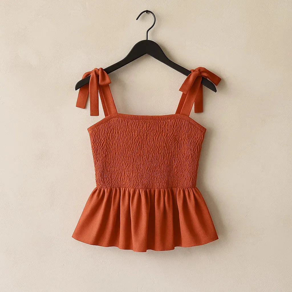 Orange smocked top with bow straps on a hanger against a beige background - BlackBole High Quality Western Dress