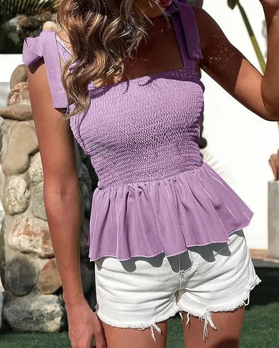 Person wearing a purple peplum top and white shorts with black patterns - BlackBole High Quality Western Dress
