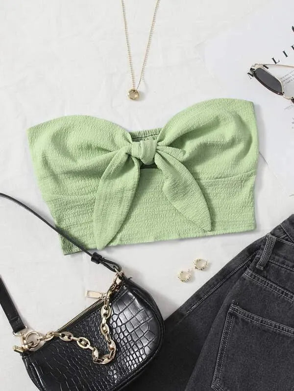 Green bow top with a black handbag and jeans on a white surface - BlackBole High Quality Western Dress