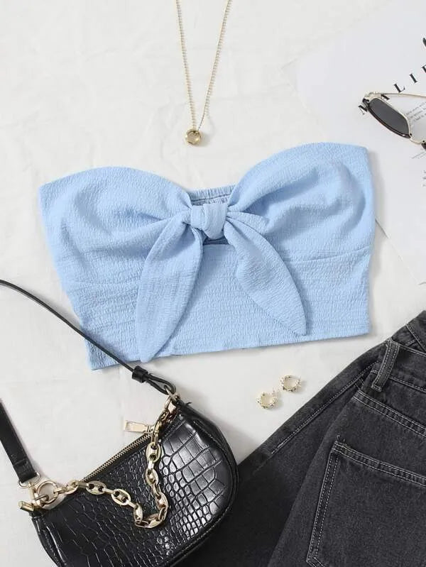 Light blue bandeau top with a bow, black handbag, and earrings on a white surface - BlackBole High Quality Western Dress