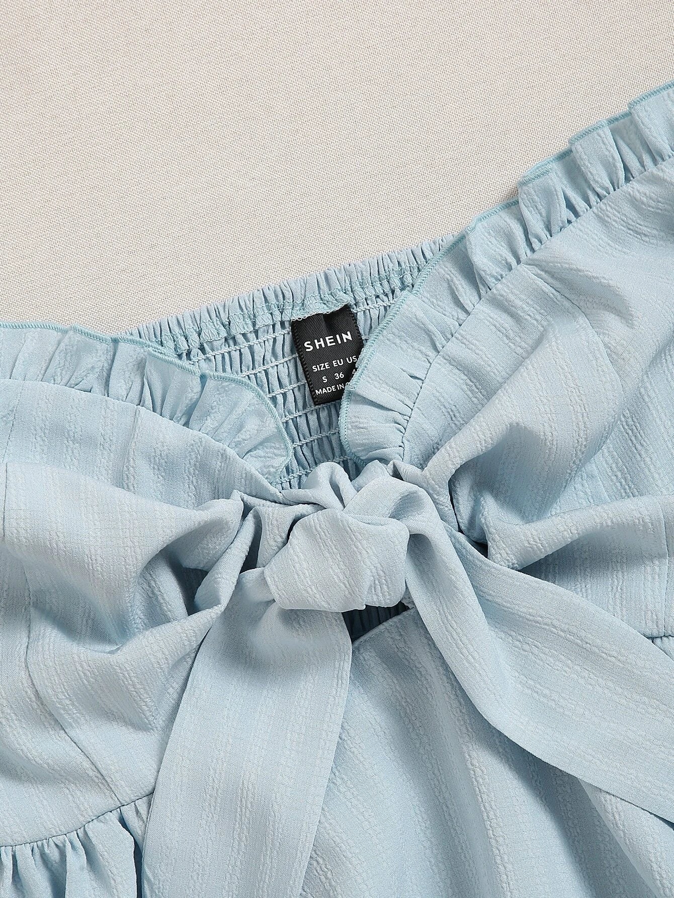Light blue fabric with a visible 'SHEIN' label on a beige background - BlackBole High Quality Western Dress