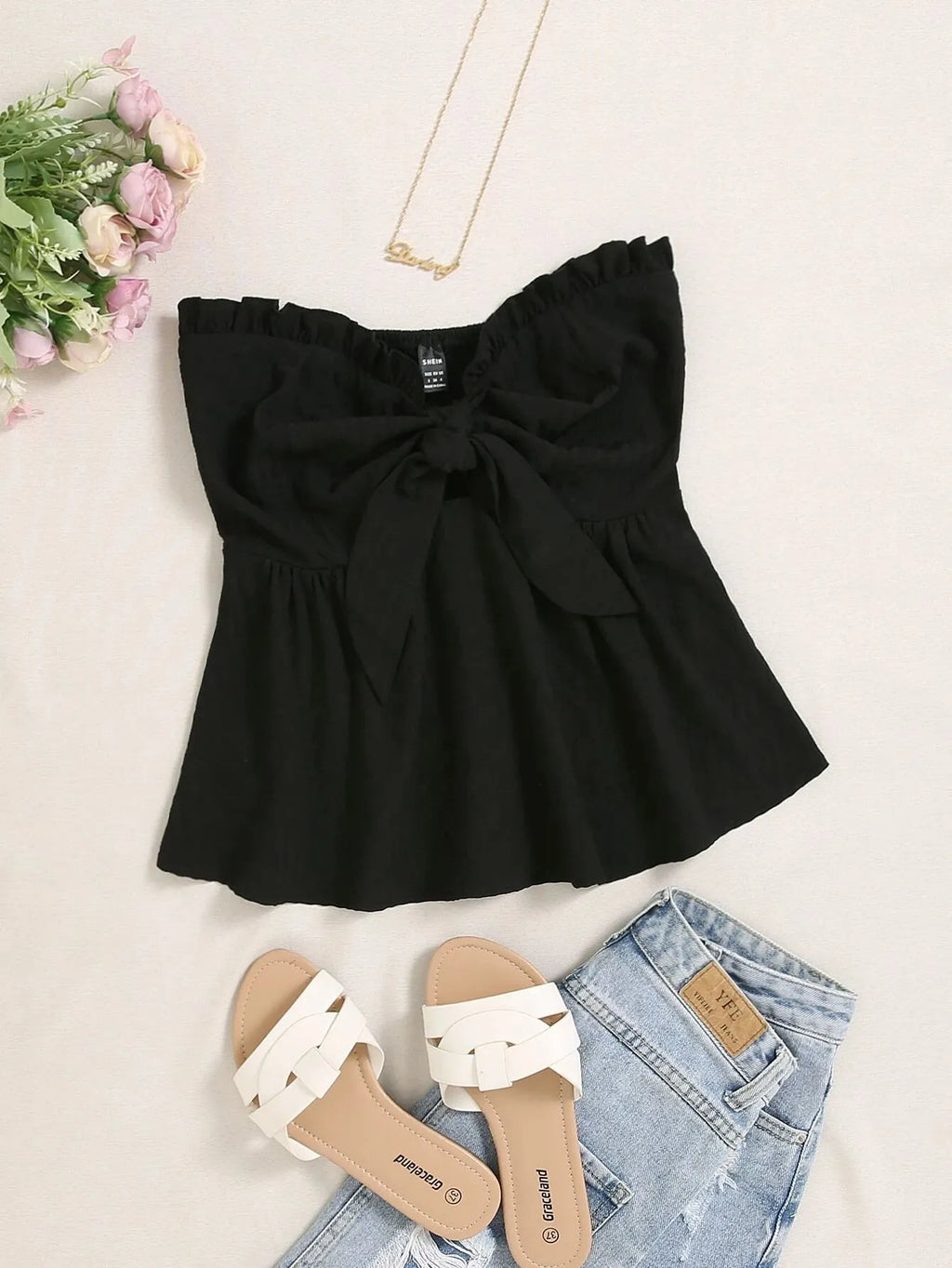 Black top with bow detail, white sandals, and denim shorts on a light background - BlackBole High Quality Western Dress