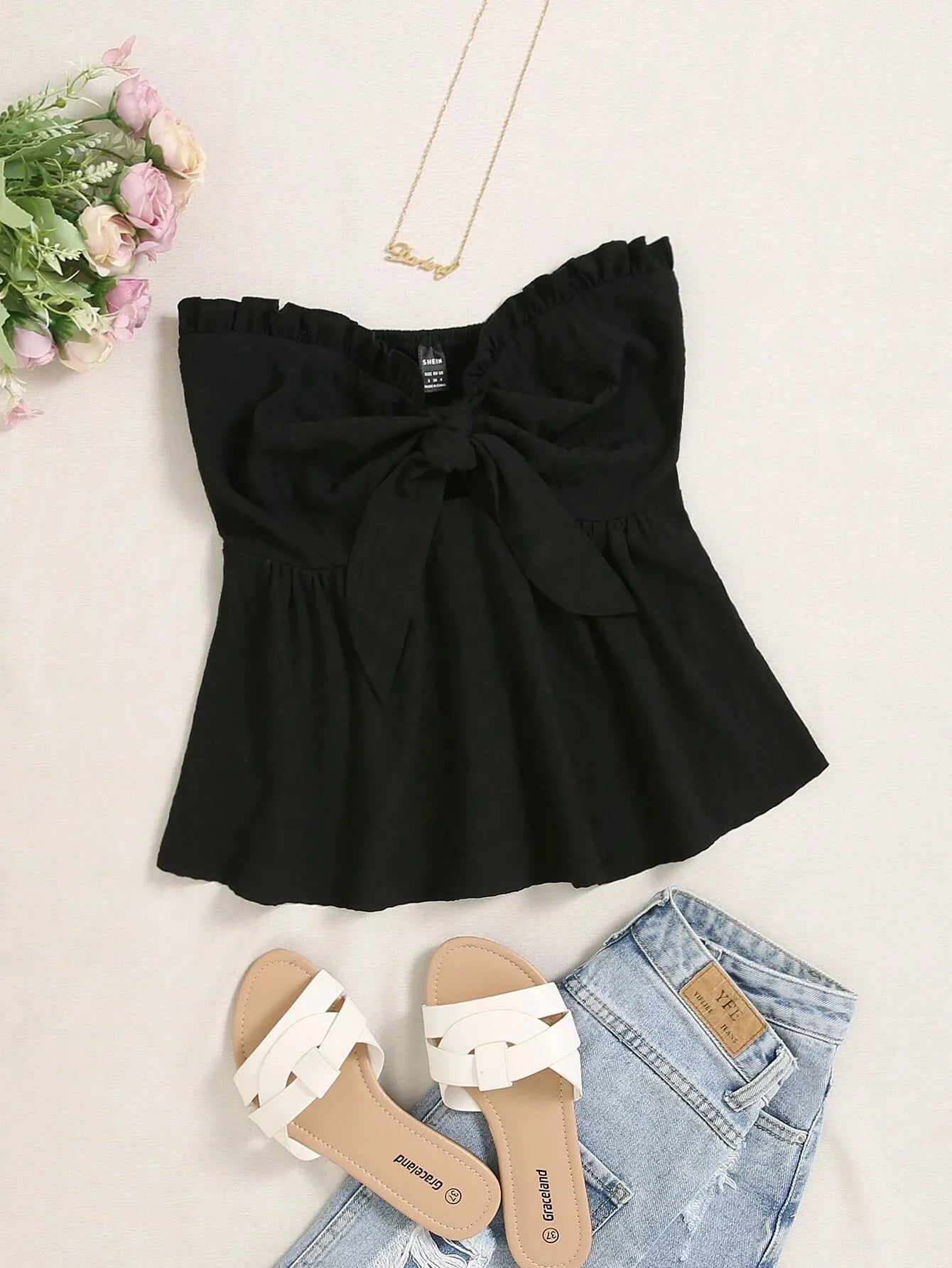 Black top with bow detail, white sandals, and denim shorts on a light background - BlackBole High Quality Western Dress
