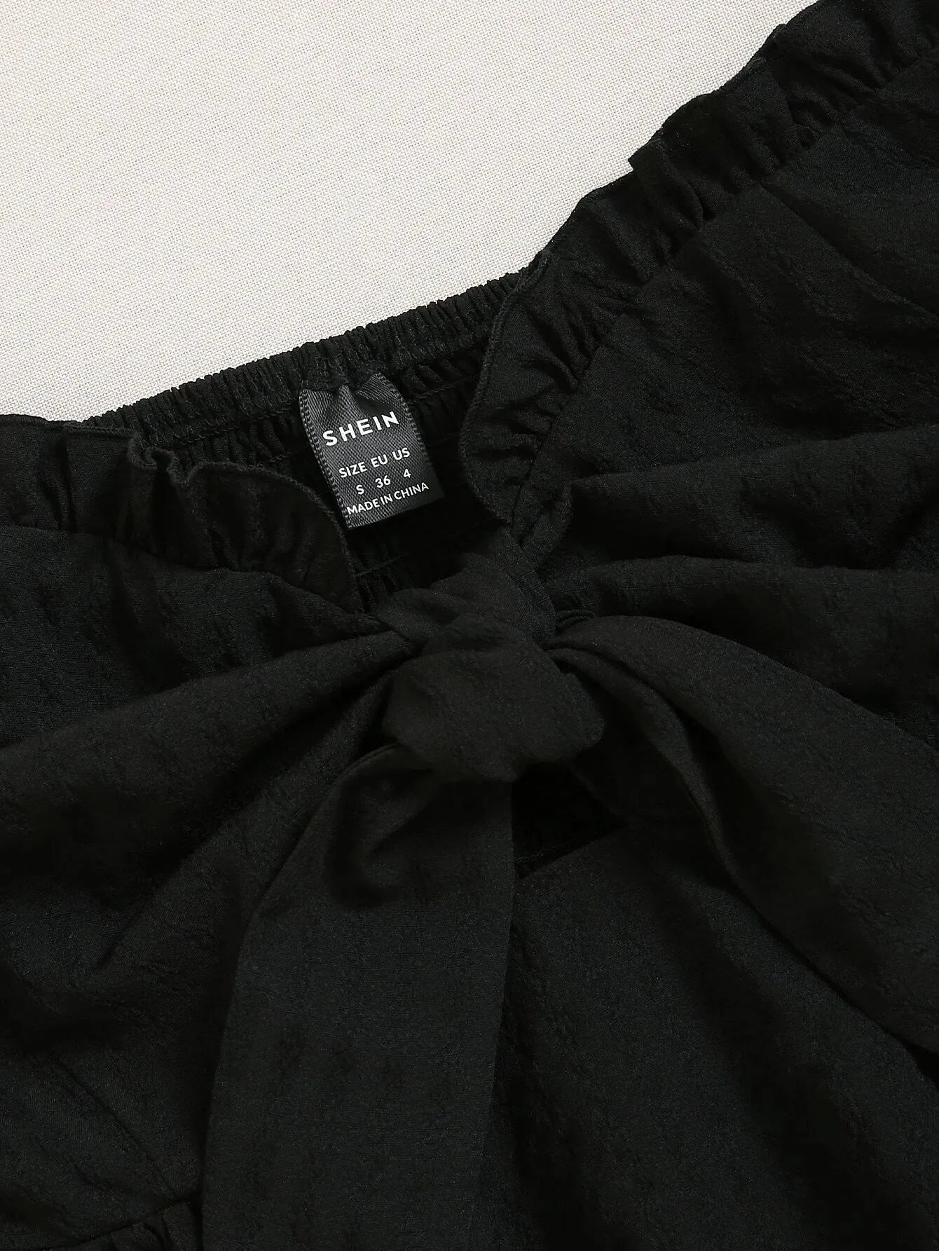 Black pants with a visible 'SHEIN' label on a light gray background - BlackBole High Quality Western Dress