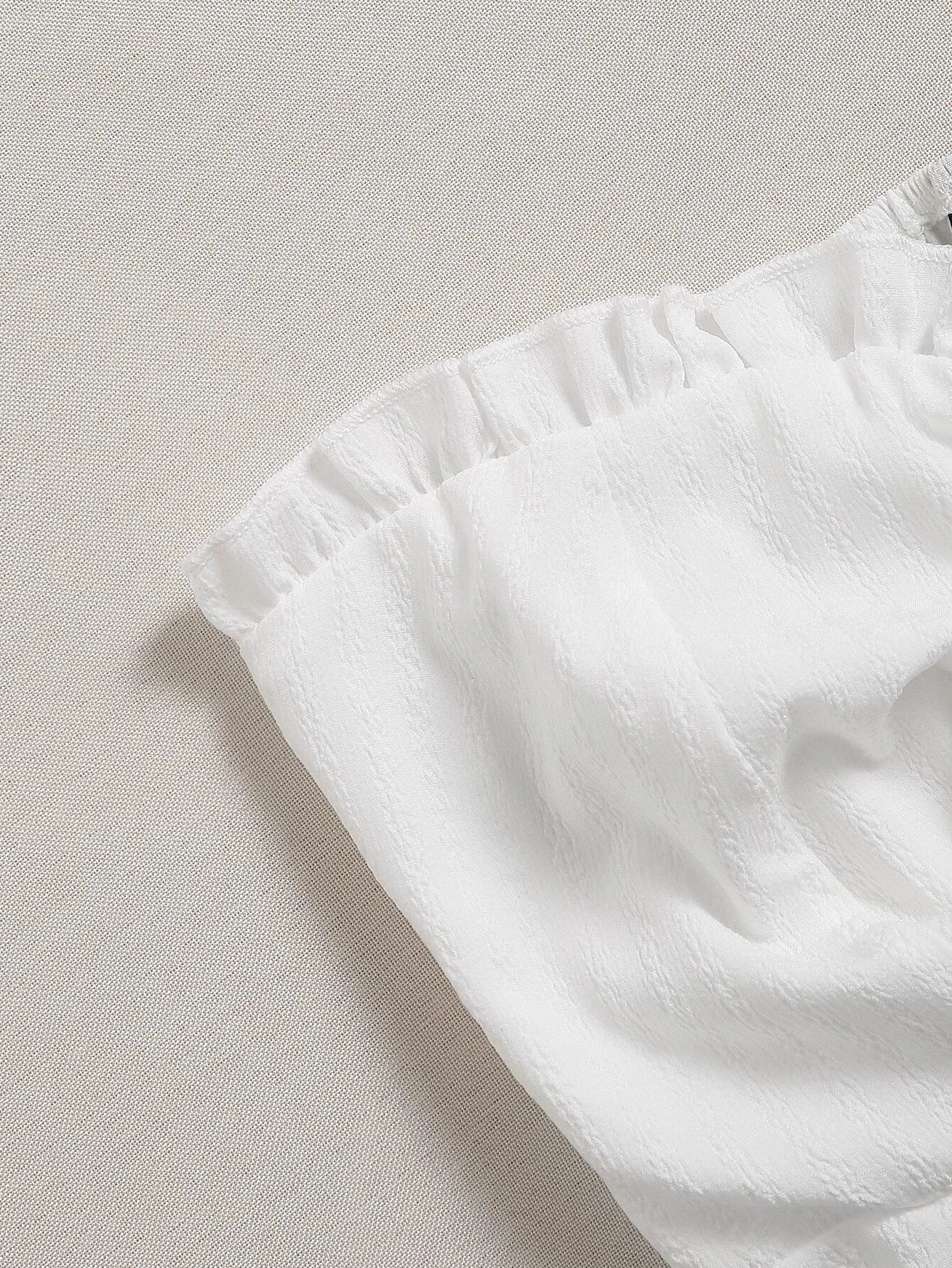 Close-up of a white fabric corner on a light gray background - BlackBole High Quality Western Dress