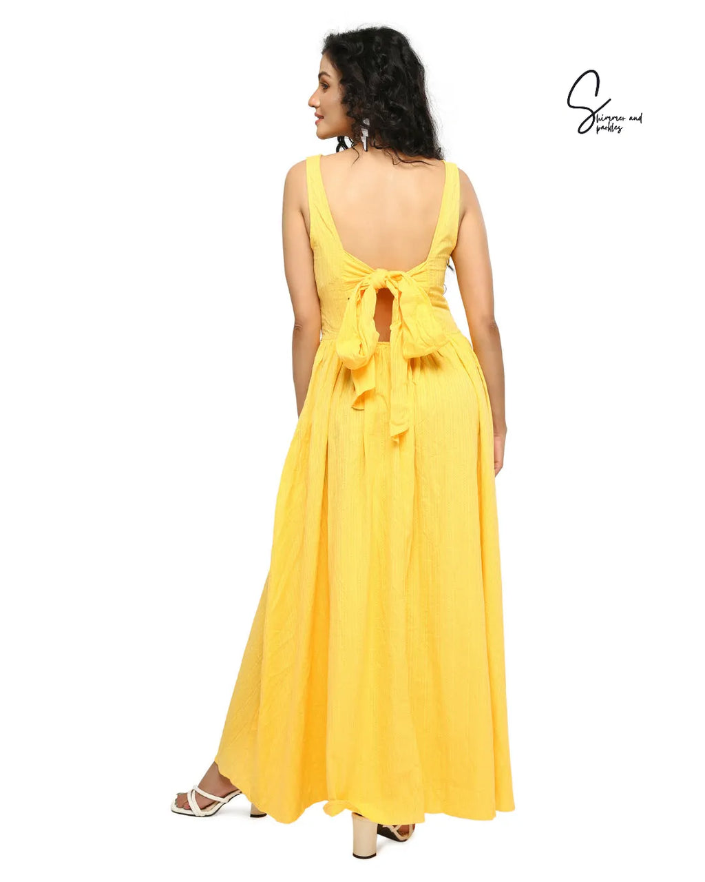Woman wearing a yellow dress with a back bow detail on a white background - BlackBole High Quality Western Dress