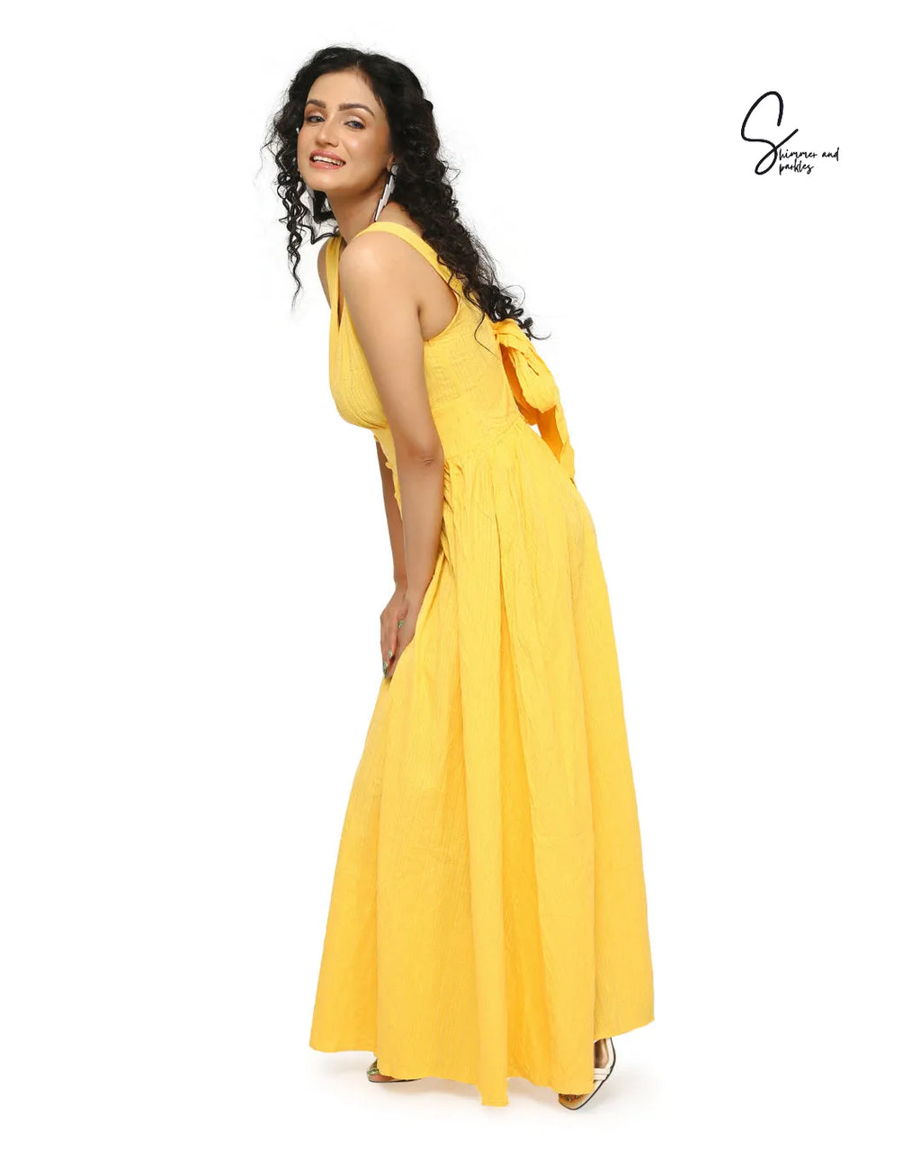 Woman wearing a yellow dress with a bow detail on a white background - BlackBole High Quality Western Dress