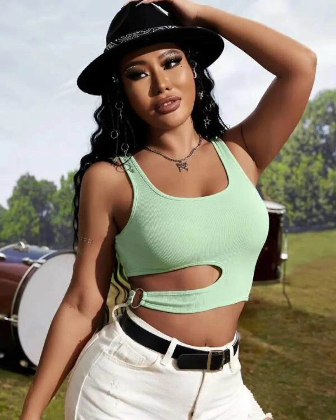 Woman wearing a green crop top with cut-out design and a black hat outdoors - BlackBole High Quality Western Dress