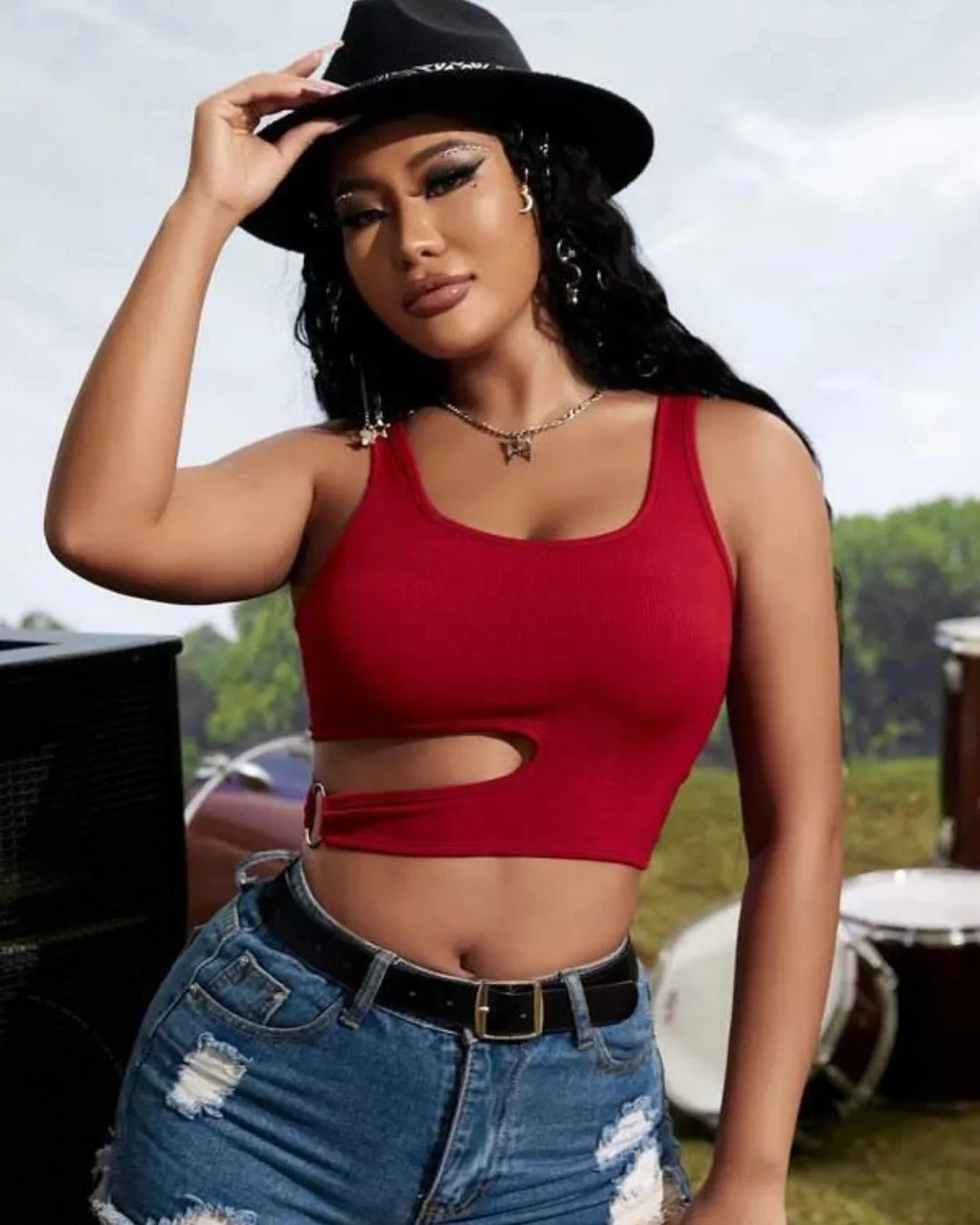 Woman wearing a red crop top and denim shorts with a black hat outdoors - BlackBole High Quality Western Dress