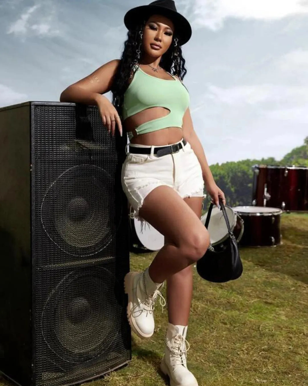 Woman posing with a large speaker at an outdoor event - BlackBole High Quality Western Dress