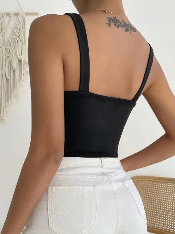 Person wearing a black tank top with thin straps and white pants against a neutral background - BlackBole High Quality Western Dress