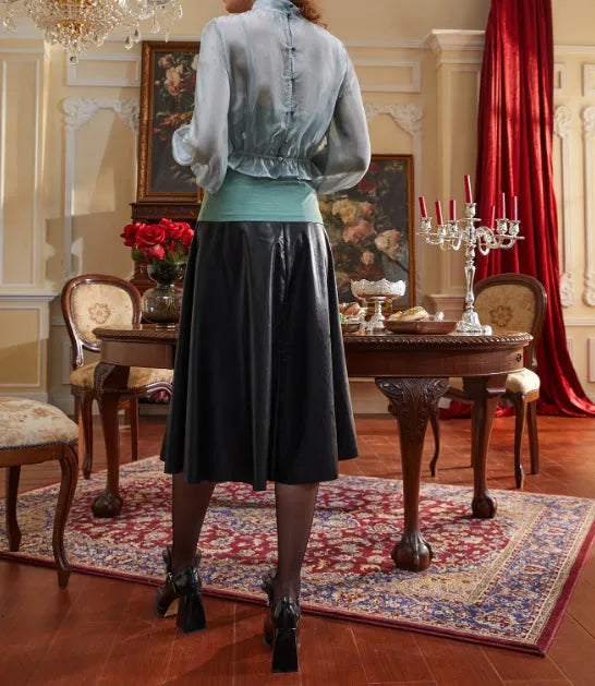 Person wearing a light blue blouse and black skirt in an elegant room with red curtains and a wooden table - BlackBole High Quality Western Dress