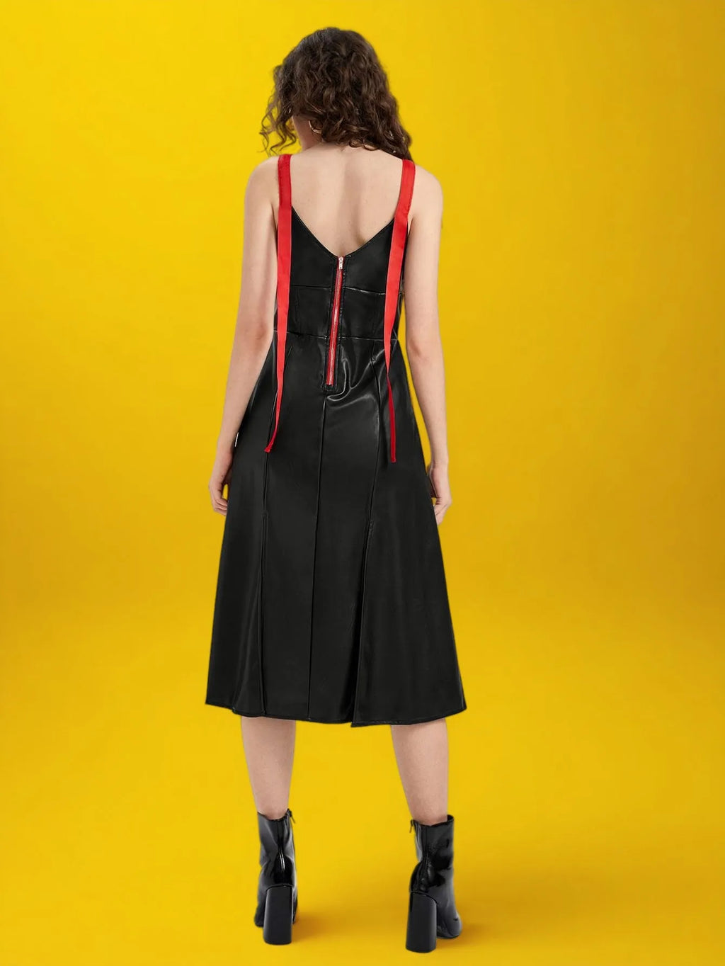 Woman wearing a black dress with red suspenders against a yellow background - BlackBole High Quality Western Dress