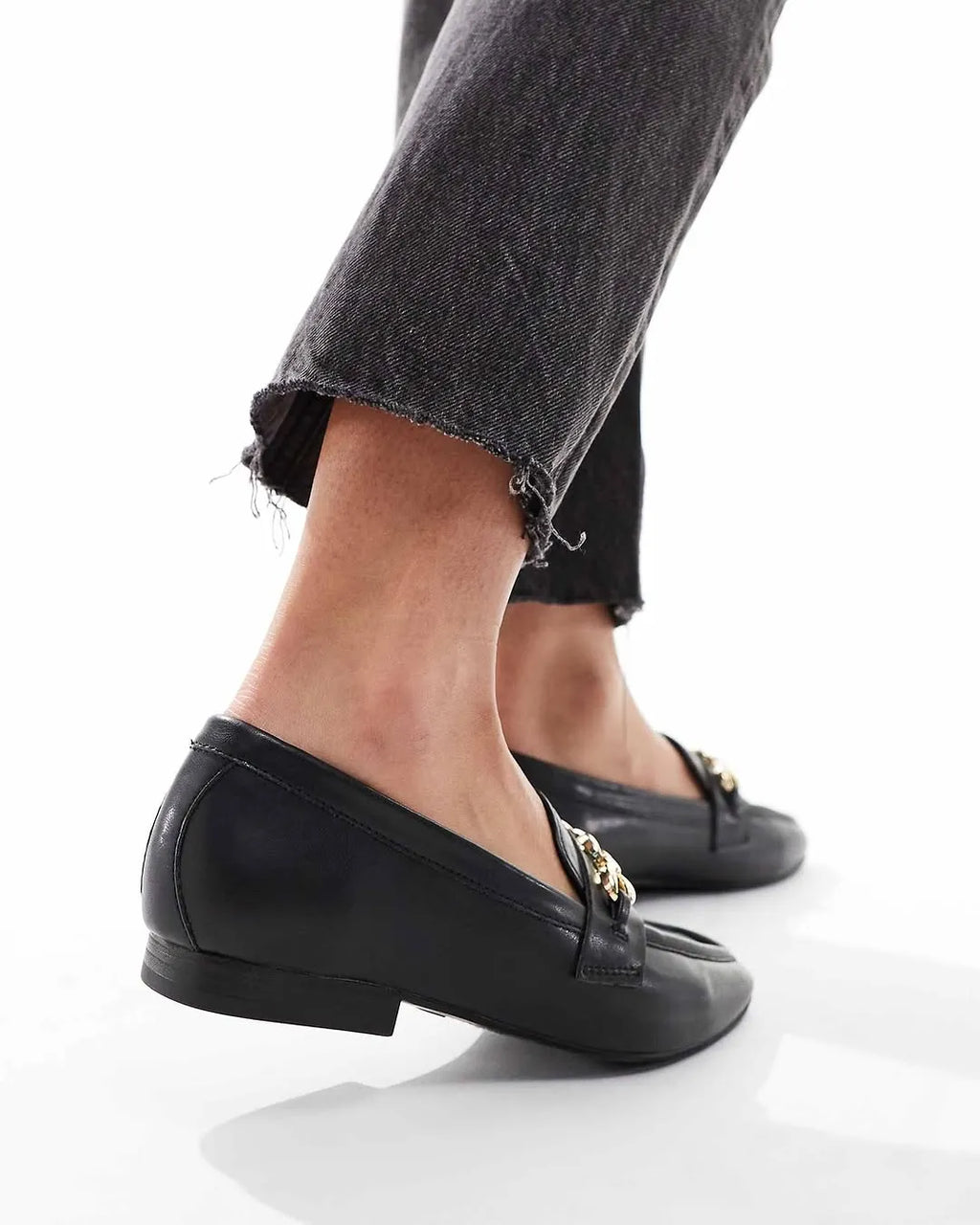 Black flats worn with black jeans on a white background - BlackBole High Quality Shoe