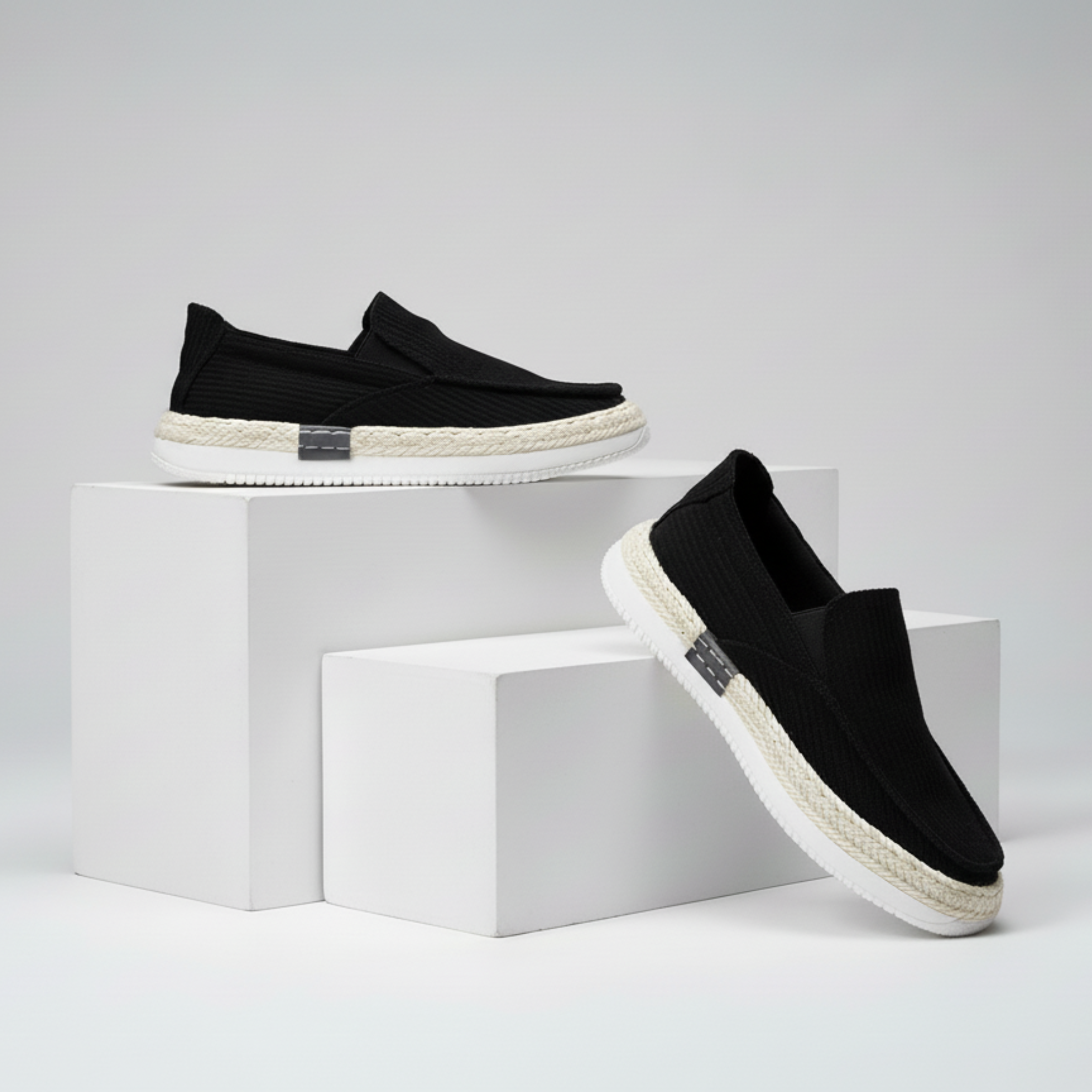 Black slip-on shoes with white soles on a gray background - BlackBole High Quality Shoe