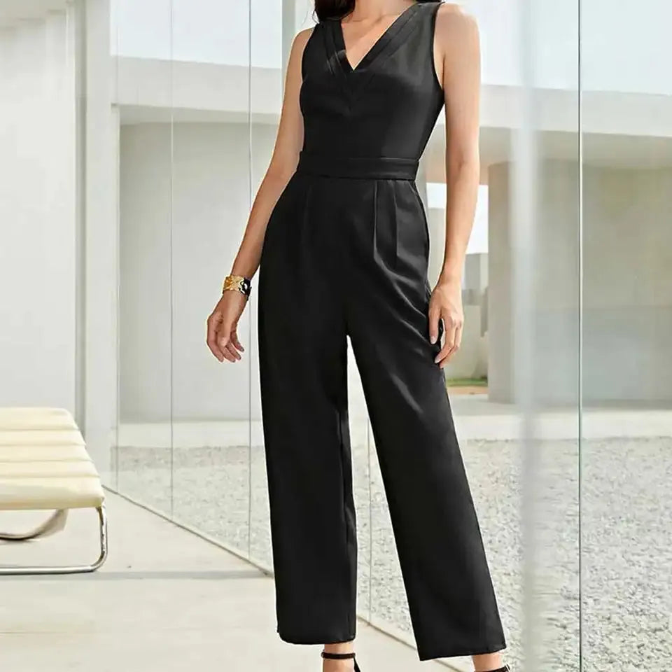 Person wearing a black jumpsuit in a modern indoor setting - BlackBole High Quality Western Dress