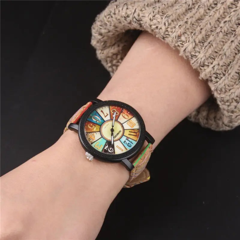 A woman's quartz watch with a floral surface and wood grain pattern, featuring a round multicolored dial and a brown leather band - BlackBole High Quality Watch