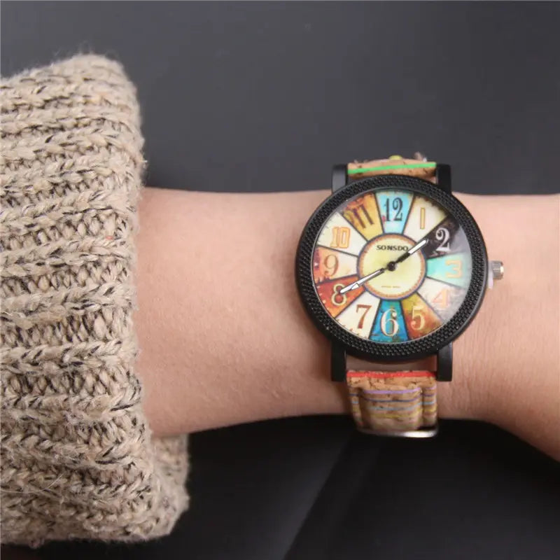A woman's quartz watch with a floral surface and wood grain pattern, featuring a round multicolored dial and a brown leather band - BlackBole High Quality Watch