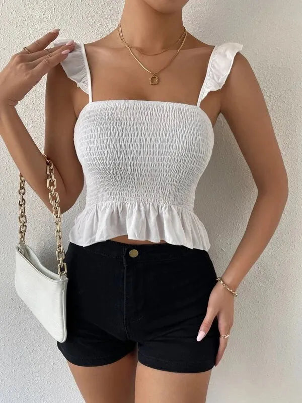 Woman wearing a white smocked top and black shorts against a neutral background - BlackBole High Quality Western Dress