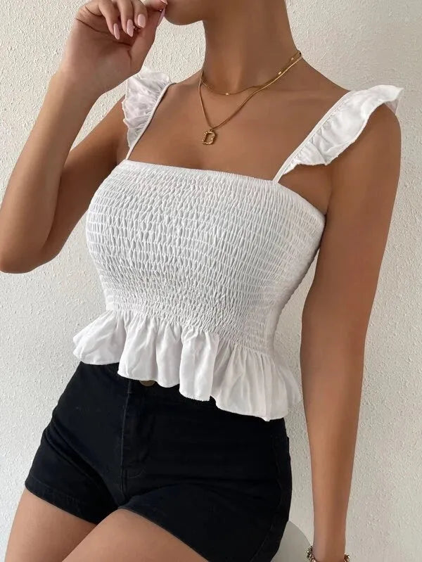 Woman wearing a white smocked top with ruffled details and black shorts against a neutral background - BlackBole High Quality Western Dress