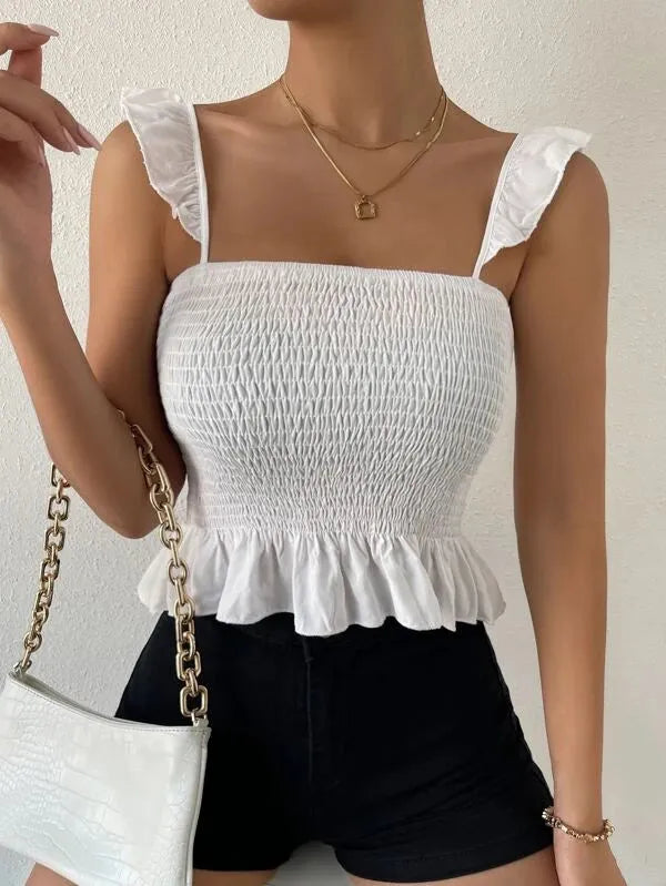 Woman wearing a white smocked top with ruffled sleeves and black shorts, holding a white handbag - BlackBole High Quality Western Dress