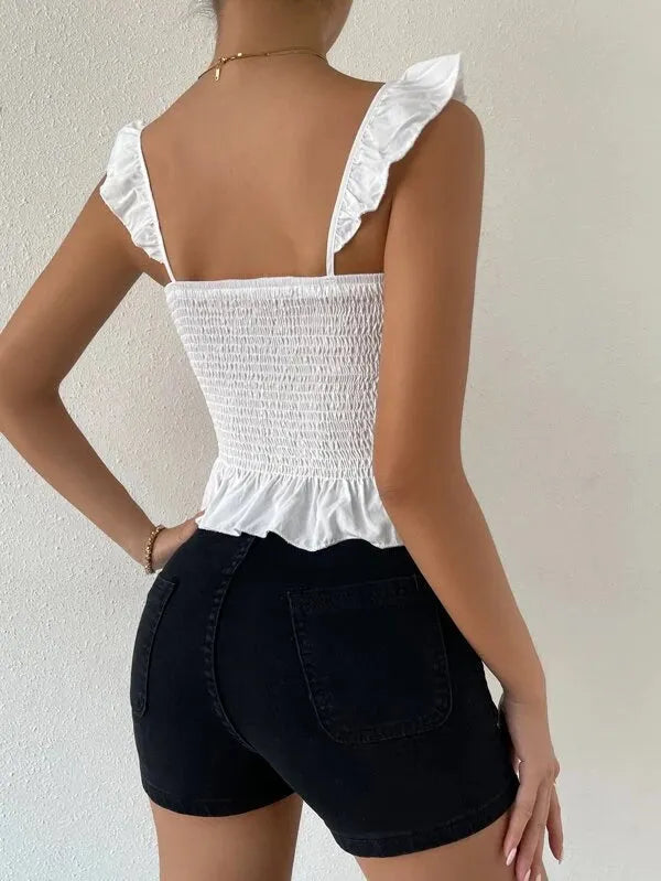 Person wearing a white ruffled top and black shorts against a neutral background - BlackBole High Quality Western Dress