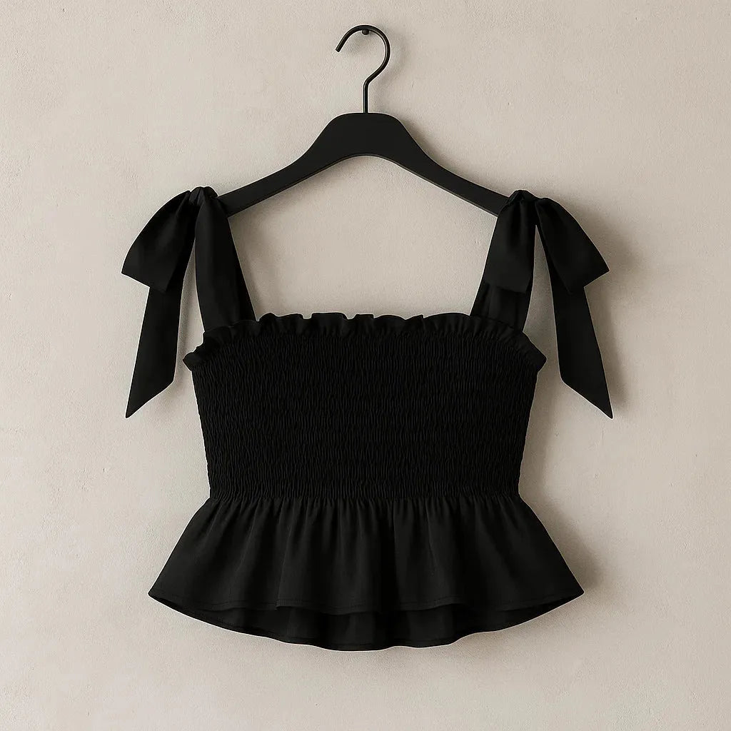 Black top with bow straps on a hanger against a beige background - BlackBole High Quality Western Dress