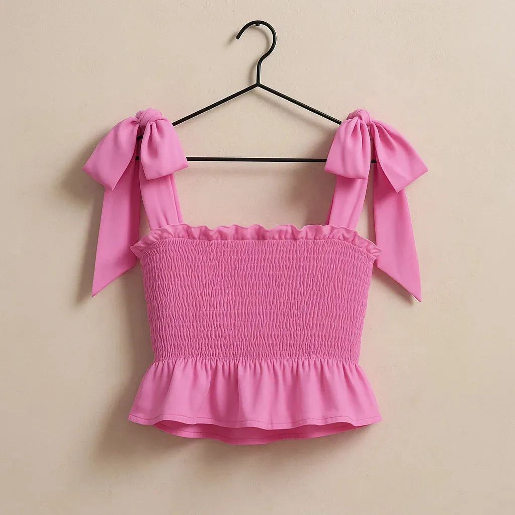 Pink top with bow straps on a hanger against a beige background - BlackBole High Quality Western Dress