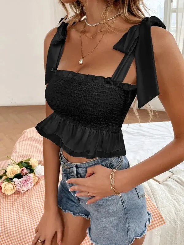 Black ruffled top with bow straps worn by a person, with a blurred background - BlackBole High Quality Western Dress