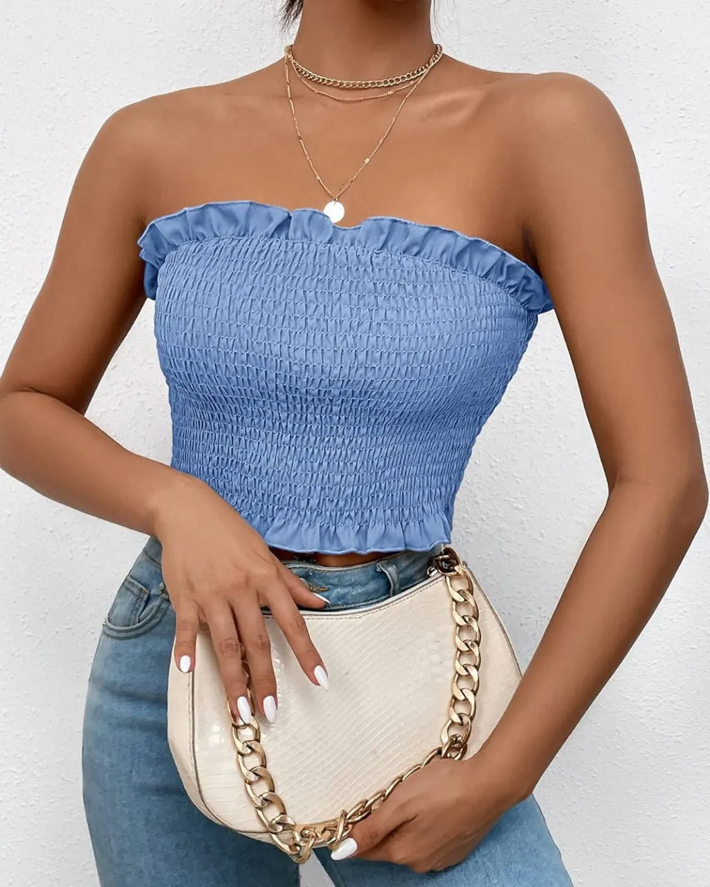 Woman wearing a blue strapless top and holding a beige handbag with a gold chain - BlackBole High Quality Western Dress