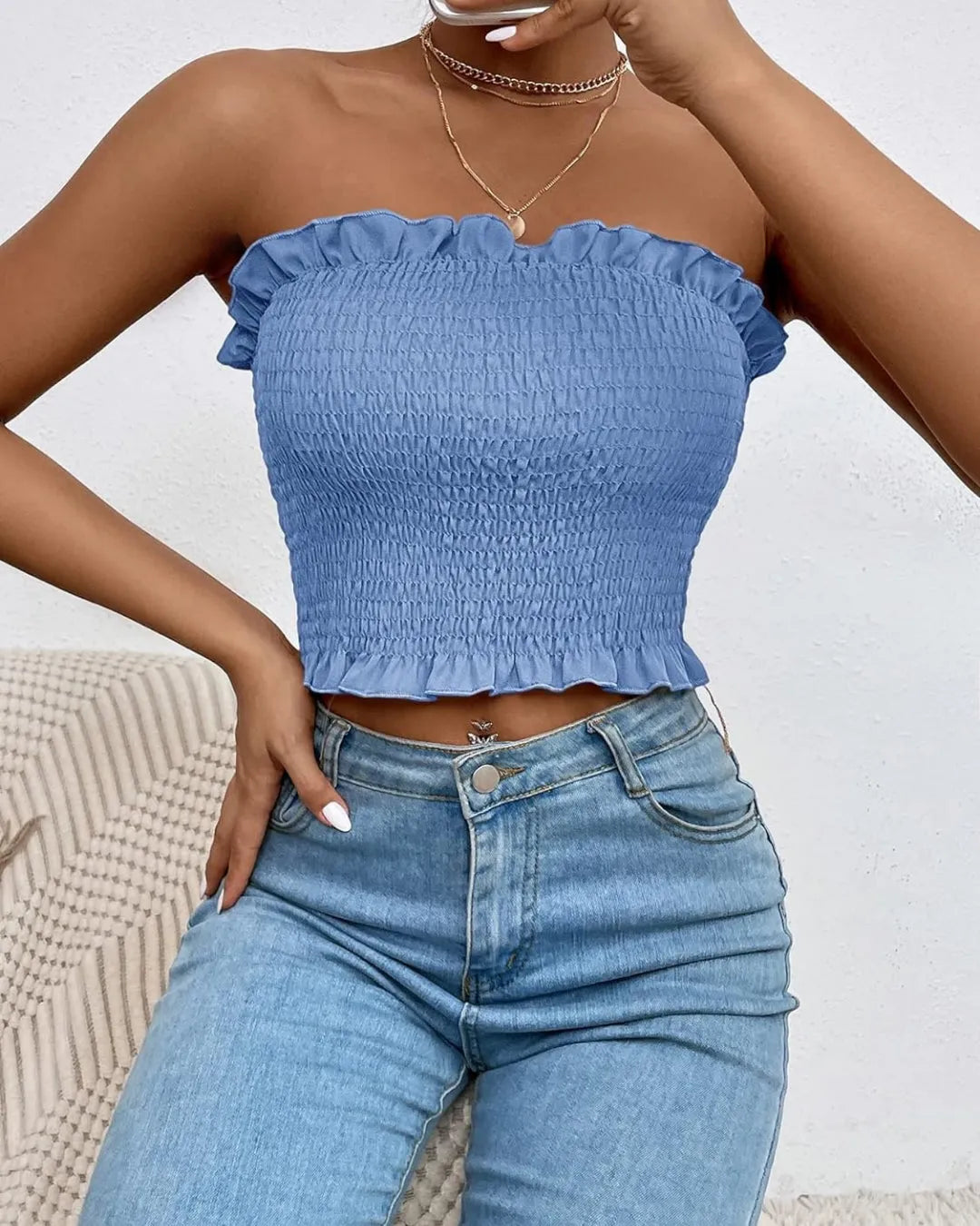 Person wearing a blue smocked top and jeans against a neutral background - BlackBole High Quality Western Dress